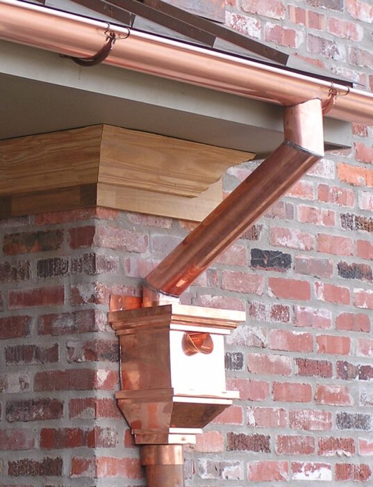 Conductor heads handle water volume to prevent drainage system failures.